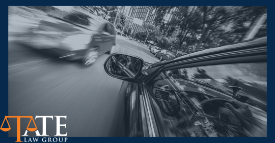 Cars driving past one another.