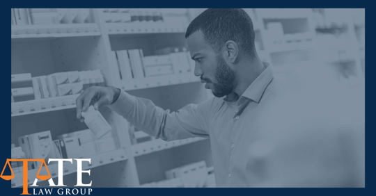 Man in pharmacy looking at over the counter medicine.
