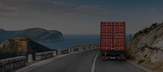 A tractor trailer on an empty road